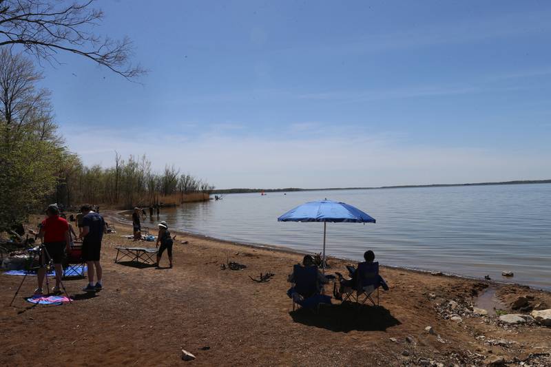 Eclipse enthusiasts gather on one of the beaches to watch the total solar eclipse on Monday, April 8, 2024 at Rend Lake.