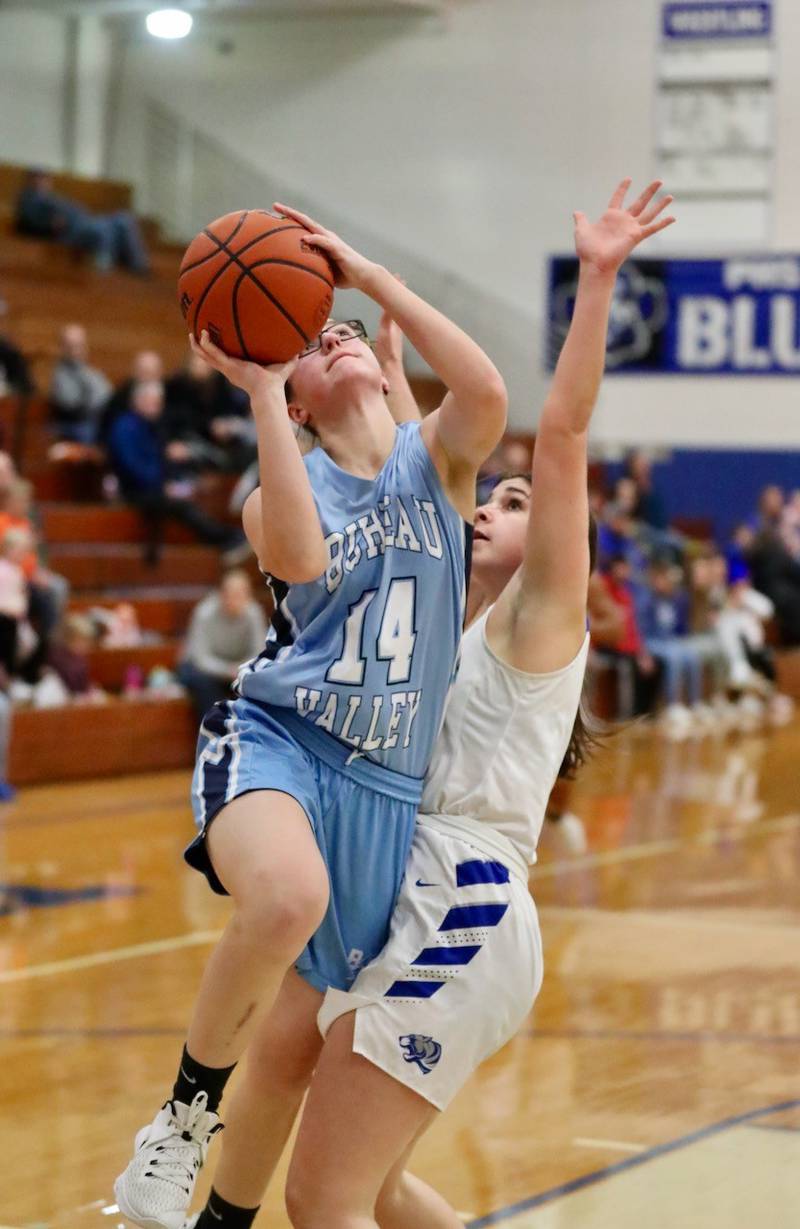 Bureau Valley's Taylor Neuhalfen shoots over Princeton's Olivia Gartin Thursday night at Prouty Gym.