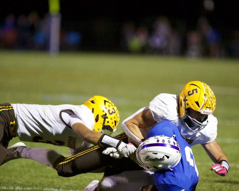 Jacobs Owen Hoffman (3) and Matthew Scardina tackle Burlington Central's Joseph Currey on Friday, October 4,2024 in Burlington.