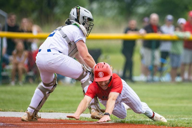 Benet Academy’s Merrick Sullivan gets tagged out by Joey Gainer during the Class 3A Kaneland Sectional final at Kaneland High School in Maple Park on Saturday, June 7, 2025.