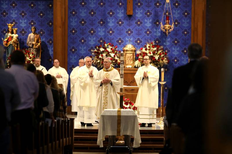 The Most Reverend David Malloy (center), Bishop of Rockford, speaks at St. Peter Catholic Church in Geneva during the Mass of Christian Burial for Reverend Jonathan Bakkelund on Wednesday, Jan. 31, 2024.