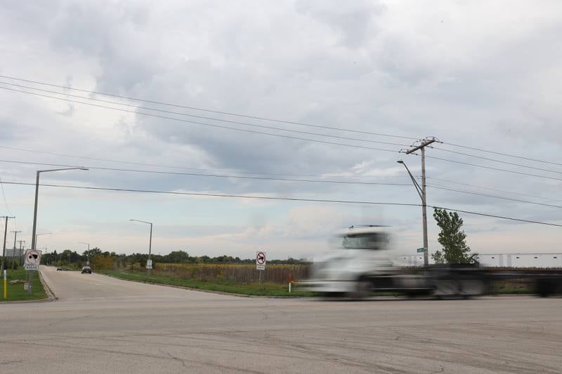 A truck drives along West Laraway Road at the intersection of Rowell Avenue on Tuesday, Sept. 26, 2023 in Joliet.