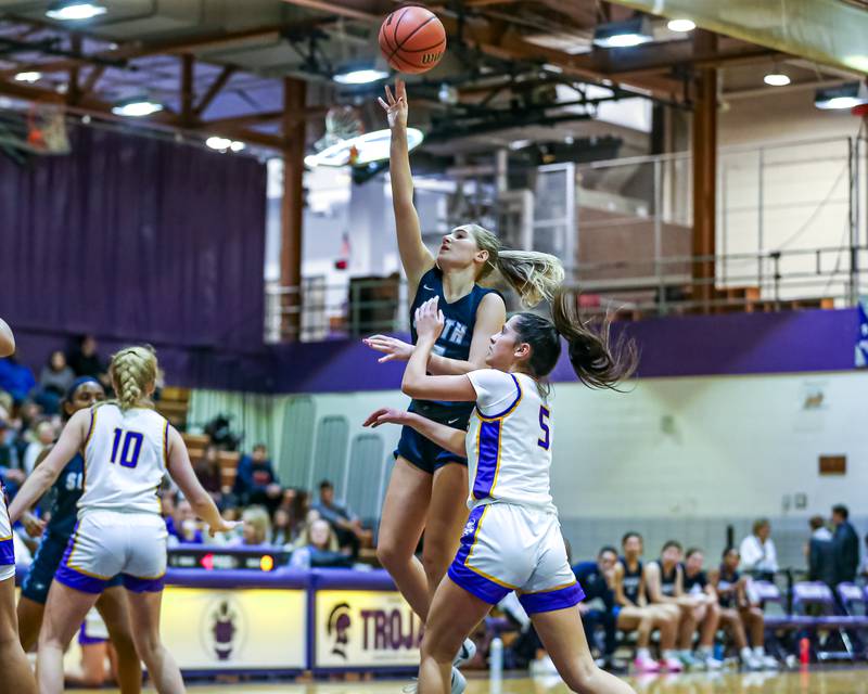 Downers Grove South's Allison Jarvis (14) puts up a shot during girls basketball game between Downers Grove South at Downers Grove North. Dec 16, 2023.
