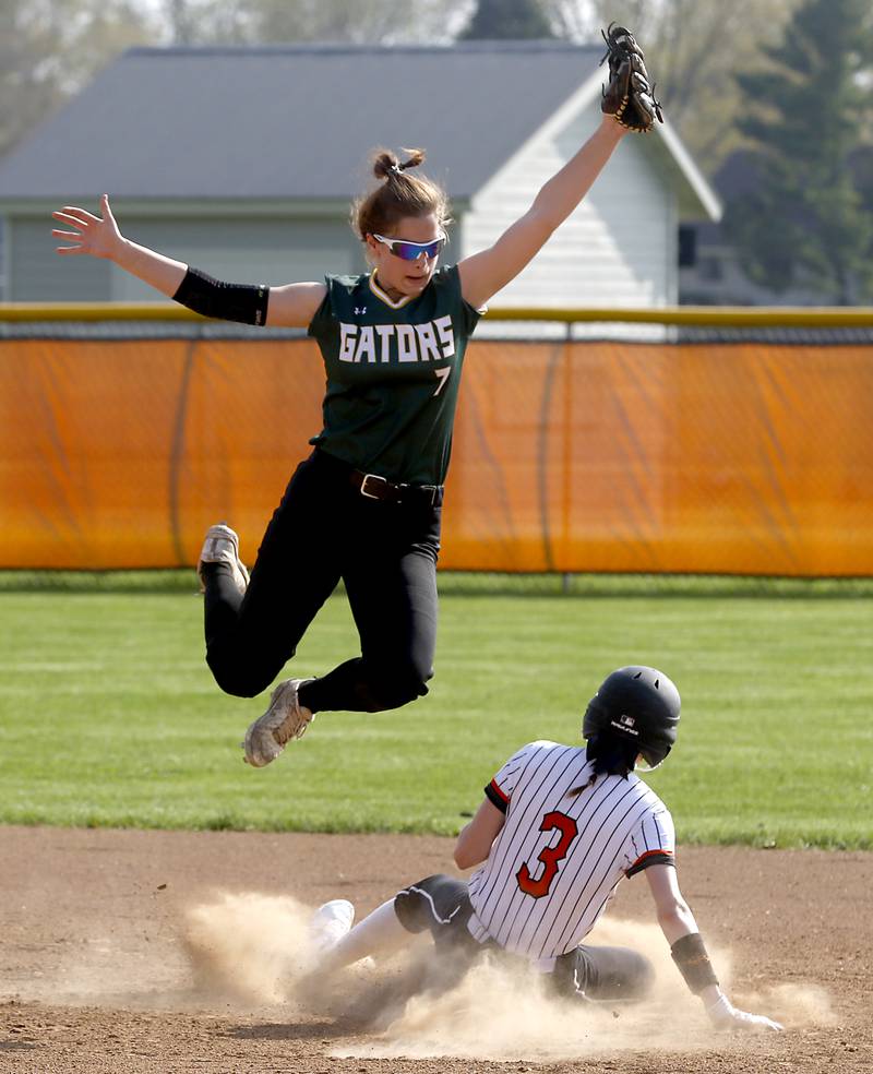 Crystal Lake South's Stephanie Lesniewski looks for the runner, McHenry's Gianna Buske, after she went up for a high throw to second base during a Fox Valley Conference softball game Monday, May 9, 2022, between McHenry and Crystal Lake South at McHenry High School.