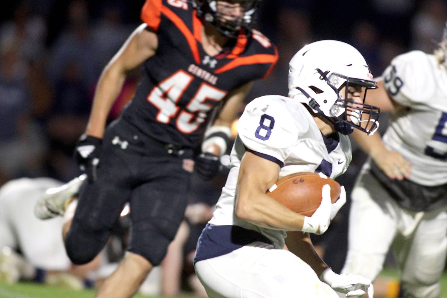 Cary-Grove’s Andrew Prio runs the ball in varsity football at Metcalf Field in Crystal Lake Friday night.