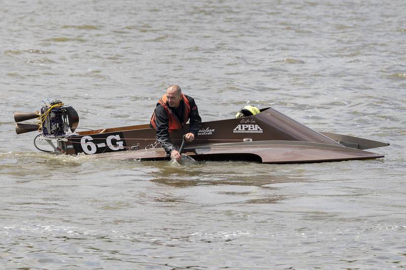 Nick Witalka paddles his boat close to shore Saturday, July 12, 2025, during a heat change in the River Chase.