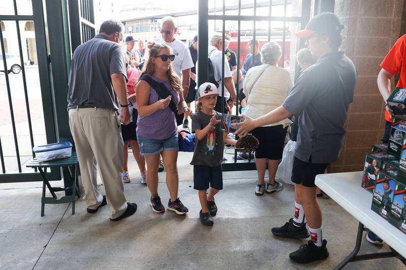 Kevin McNeil, 7, gets his Bill Murray bobblehead while attending the Slammers game with his mother Liz on Saturday July 6, 2024 in Joliet.