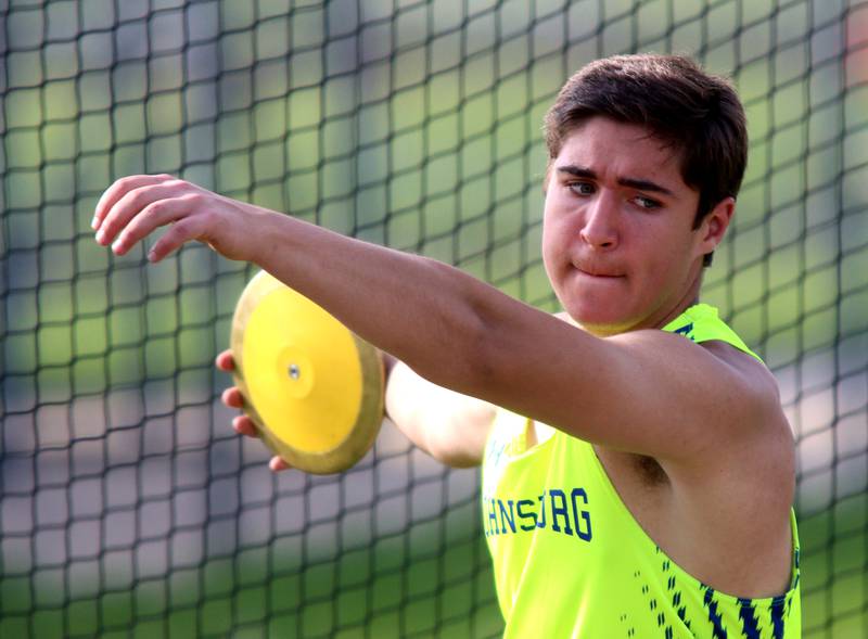 Colton Centnarowicz of Johnsburg throws the discus during Kishwaukee River Conference track meet action at Marengo Tuesday night.