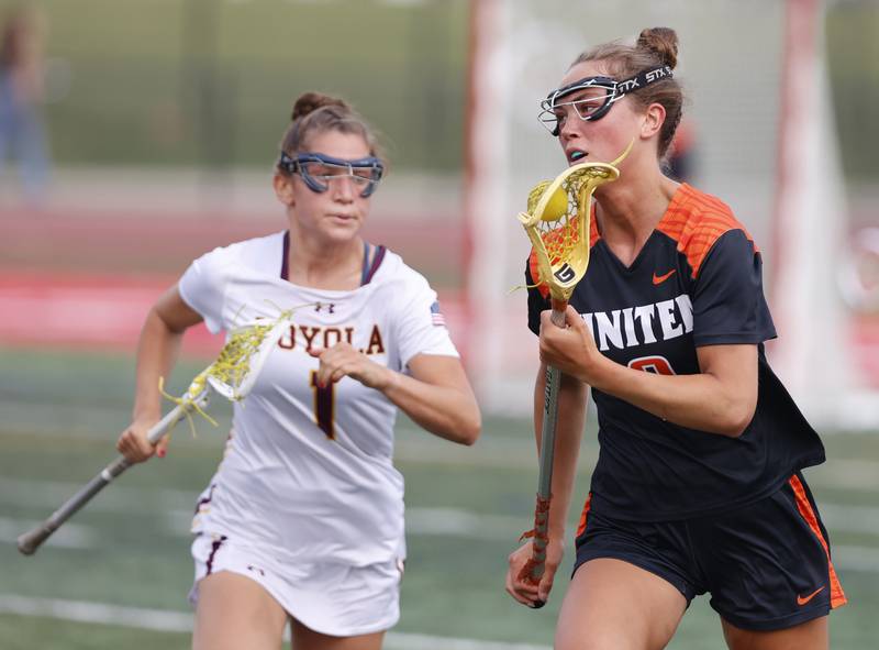 Crystal Lake Central Coop's Fiona Lemke (9) looks for an outlet during the lacrosse state semi-final match between Crystal Lake Central and Loyola Academy on Thursday, June 5, 2025 in Hinsdale.