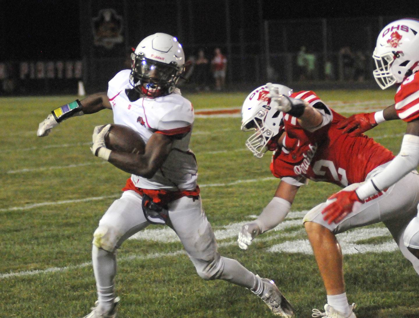 Streator's Isaiah Brown (1) tries to avoid the tackle of Ottawa's Luke Boaz (12) and Keevon Peterson (23) at King Field on Friday, Sept. 1, 2023.