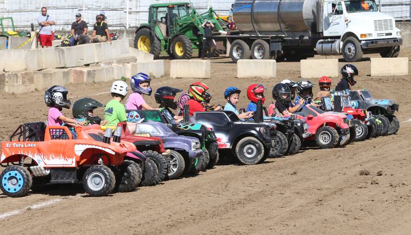 Kids line up for the start of the Power Wheels Kids Demo Derby during the 170th annual Bureau County Fair on Saturday, Aug. 23, 2025 in Princeton.