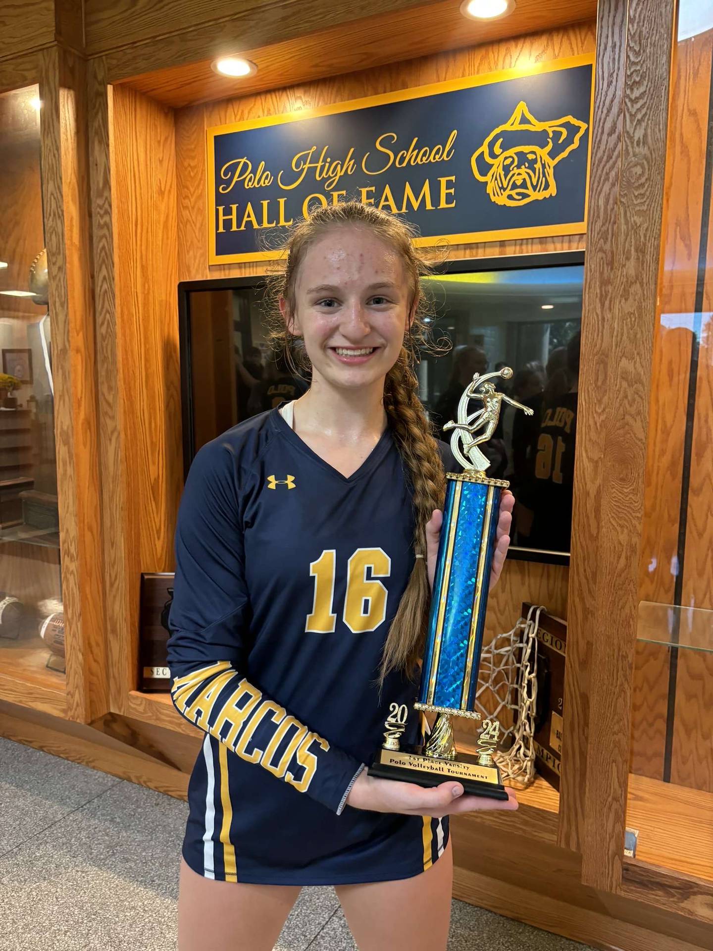 Polo volleyball player Bridget Call is pictured with the Polo tournament first-place trophy. Polo went 4-0 to take first over Milledgeville via tiebreaker on Sept. 28.