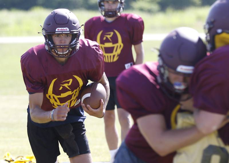 Richmond-Burton’s Joe Miller runs with the ball during summer football practice Thursday, July 14, 2022, at Richmond-Burton High School in Richmond.