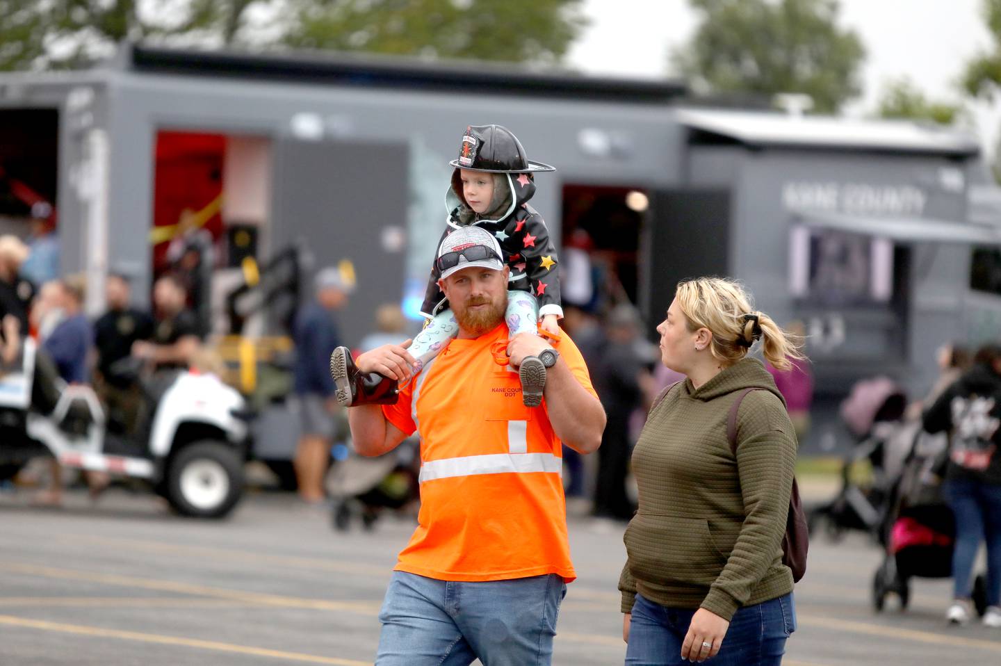 Samantha and Jonathan Cauth and their daughter, Virginia, 3, of Pingree Grove attend the Kane County Sheriff’s National Night Out in St. Charles on Tuesday, Aug. 6, 2024.