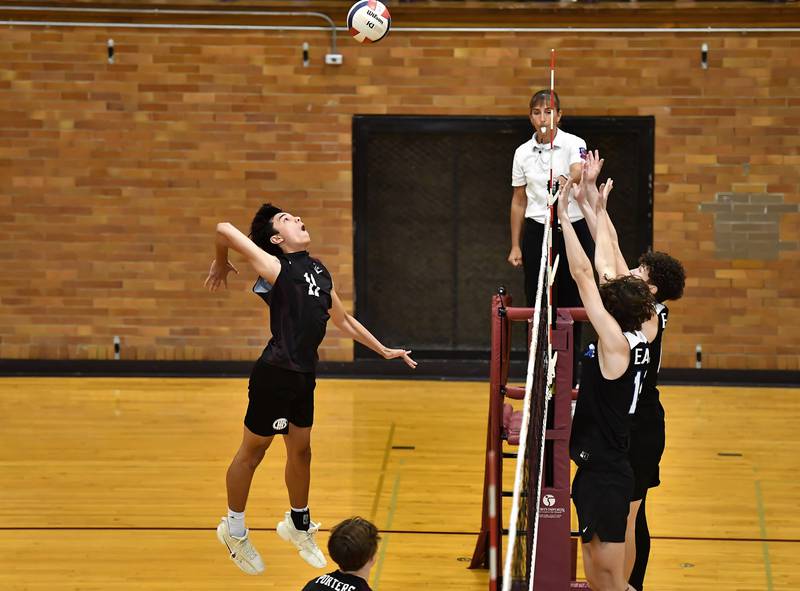 Lockport's Nathan Nacino attempts to hit the ball over Lincoln-Way East's defenders during the regional championship game on Thursday, May. 25, 2023, at Lockport.