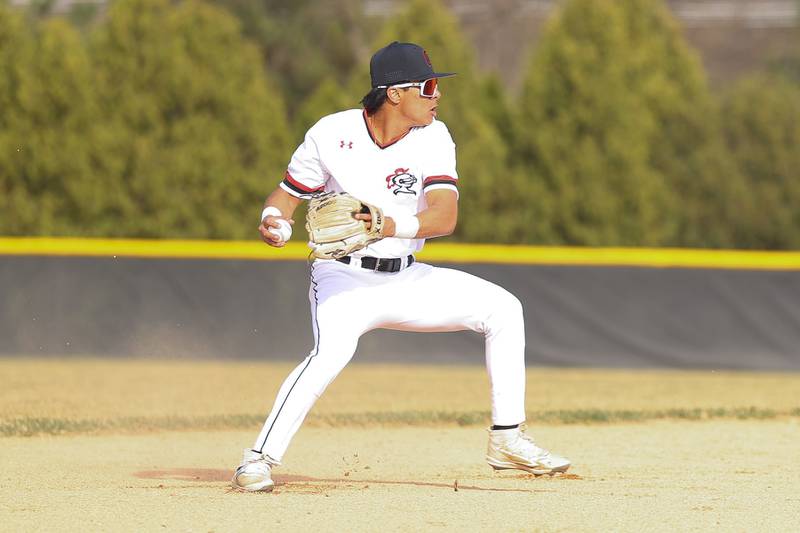 Lincoln-Way Central’s Dev Sharma makes a throw to first gainst Joliet Catholic on Wednesday, March 25, 2026 in New Lenox.