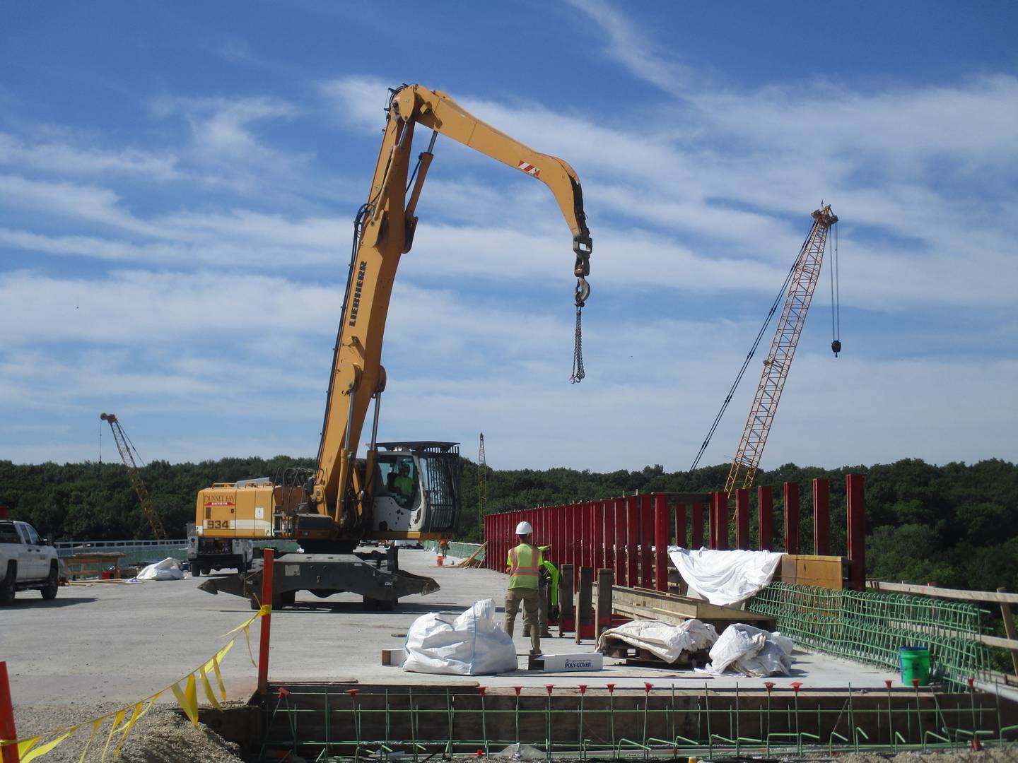 Construction cranes are at work to build the Eldamain Road bridge. (Mark Foster -- mfoster@shawmedia.com)