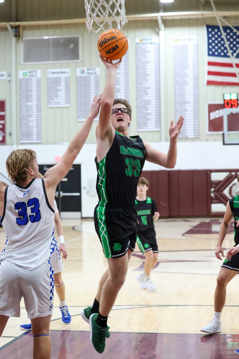 Bishop McNamara's Callaghan O'Connor maneuvers to the basket under pressure from. Clifton Central's Jake Thompson during the Fightin' Irish's 62-41 victory in the Watseka Holiday Tournament championship on Tuesday, Dec. 16, 2025.