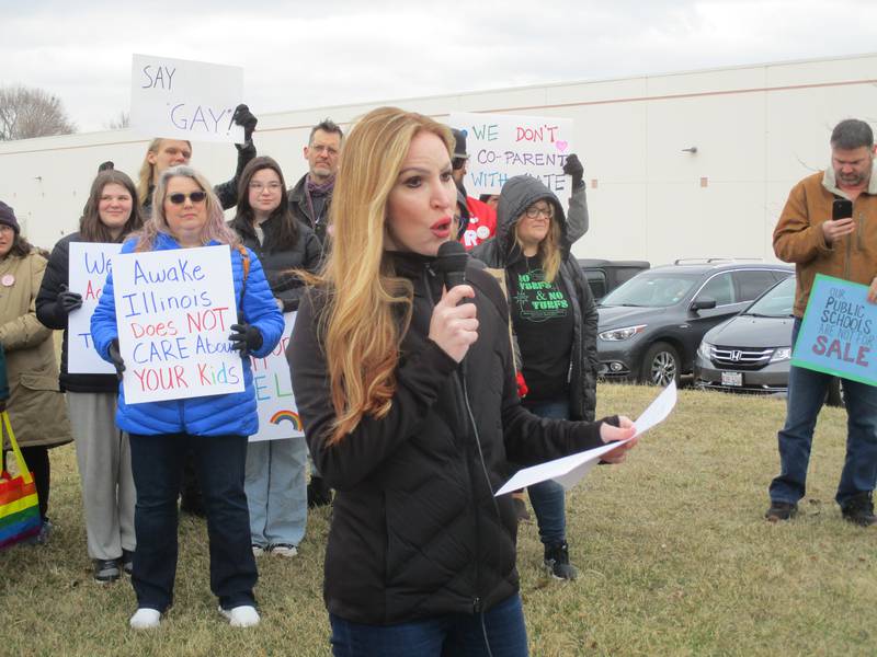Oswego School District 308 parent Jennifer Stamp speaks at a rally for LGBTQ+ rights on March 11, 2023 in Oswego.