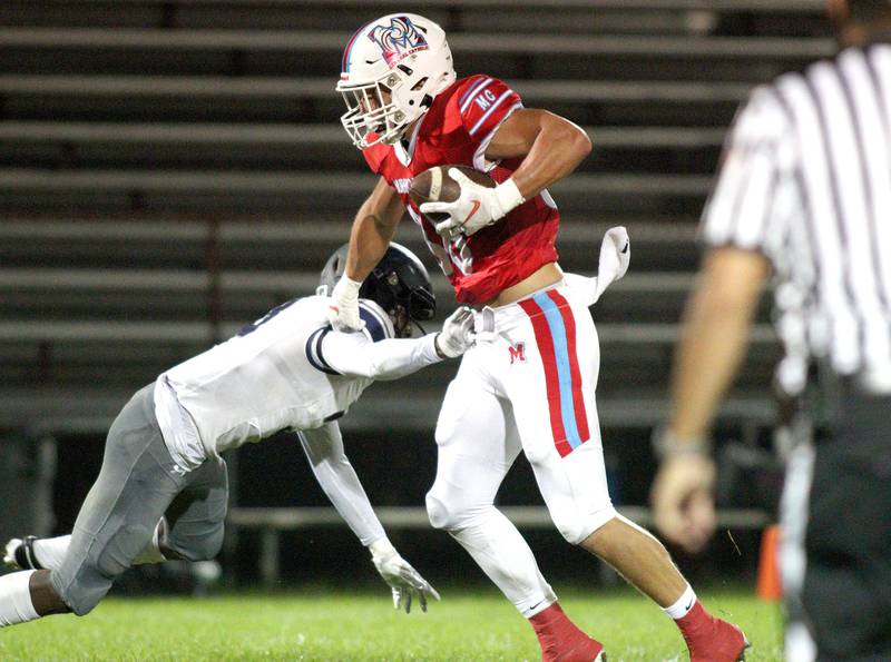 Marian Central’s Christian Bentancur looks for running room against Chicago Hope in varsity  football at Woodstock Friday night.