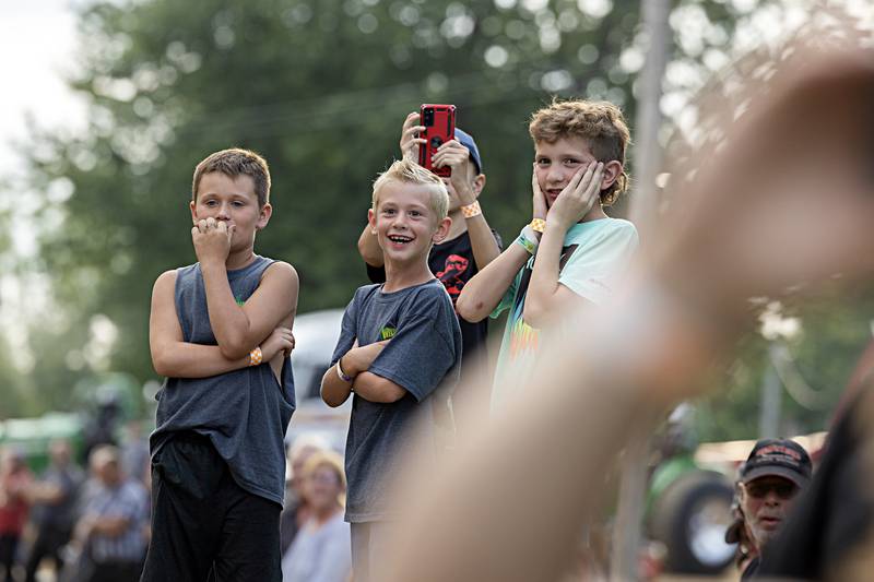 Spectators watch as the tractors go full bore down the track Wednesday, August 9, 2023 at the Carroll County fair.