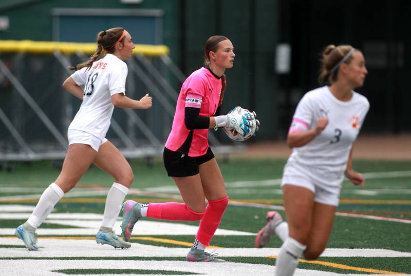 Wheaton Warrenville South goal keeper Marilyn Dixon (center) looks to pass the ball during the Class 3A Glenbard West Sectional final against St. Charles North on Friday, May 30, 2025 in Glen Ellyn.