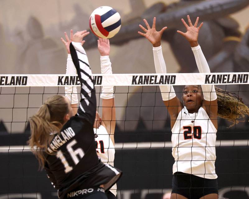 DeKalb's Zora Watts tries to block the spike of Kaneland's Francesca Rio Thursday, Sept. 4, 2025, during their match at Kaneland High School in Maple Park.