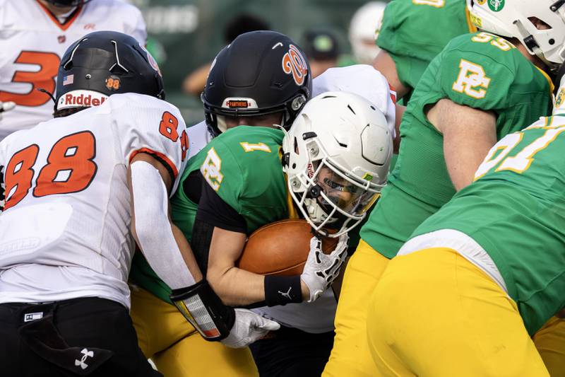 Providence's Bryaden McKay tries to find and opening during a 5A varsity football playoff game against Washington at Providence on Nov. 15, 2025.