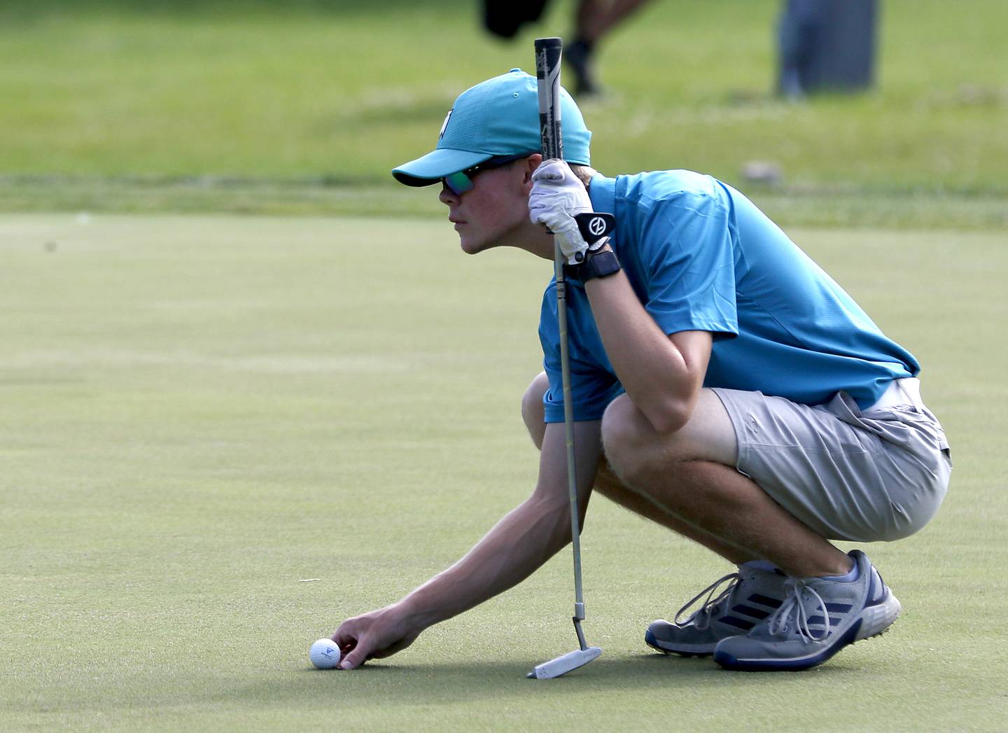 Huntley’s Nooa Hakala lines up his putt on the first green of the Prairie course Wednesday, July 13, 2022, during the second round of the the McHenry County Junior Golf Association's McHenry County Junior Amateur tournament at Boone Creek Golf Club, in Bull Valley.