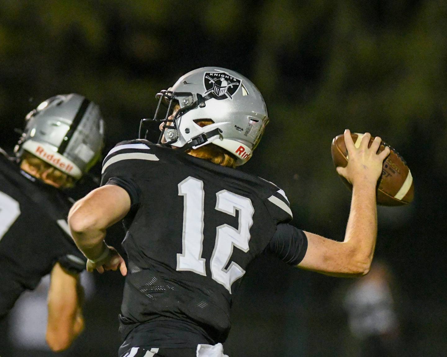 Kaneland's Brody Guthrie (12) throws for a long pass that was incomplete during the game on Friday Sept. 26, 2025, while taking on Morris held at Kaneland High School.