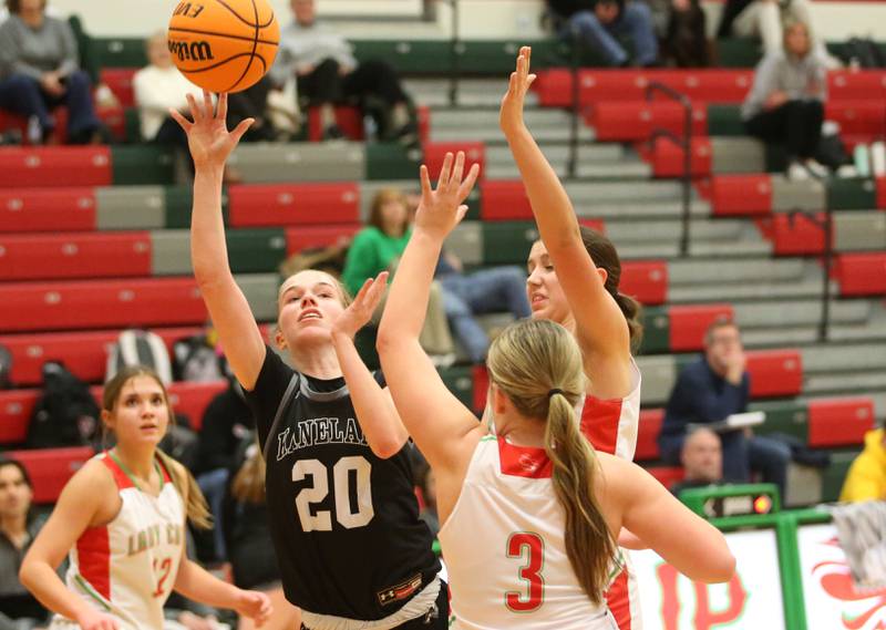 Kaneland's Samantha Kerry lets go of a shot over L-P's Emma Jereb on Wednesday, Jan. 15, 2025 in Sellett Gymnasium at L-P High School.