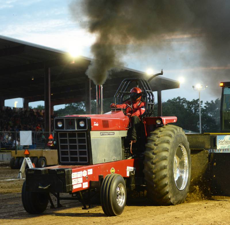 Alec Kock of Princeton competes in the Illini Truck & Tractor Pulls at the Ogle County Fair on Thursday, Aug. 1, 2024.