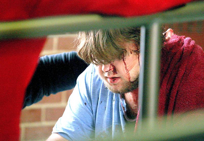 Shaw Local 2008 file photo – An apparent shooting victim is treated for sustained injuries inside Neptune Central on the Northern Illinois University campus in DeKalb Thursday afternoon, Feb. 14, 2008.