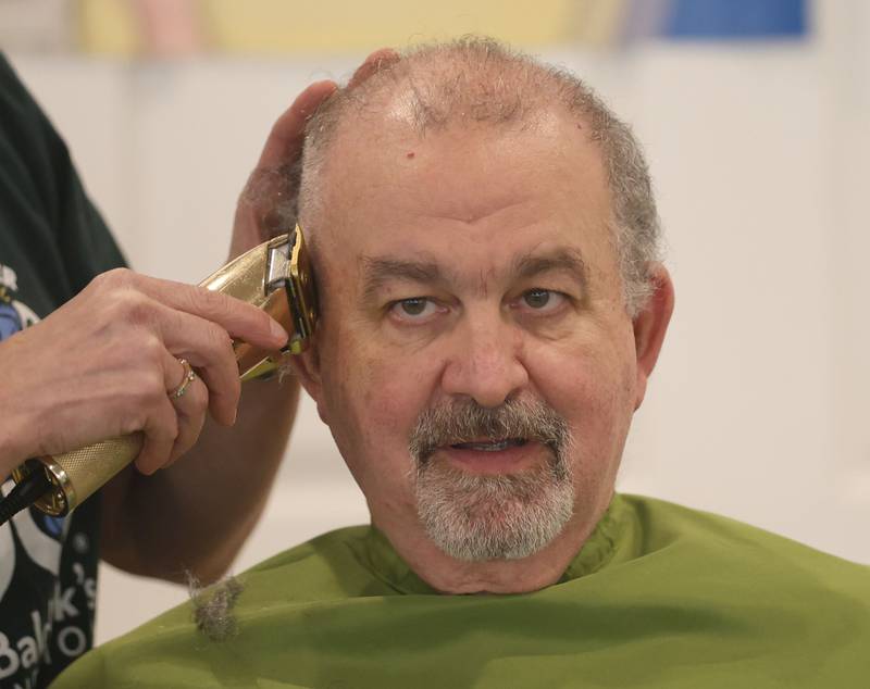 Mark Bierbom Utica EMS director, has his head shaved during the 19th annual Illinois Valley Emergency Services Annual St. Baldrick's Event on Sunday, March 22, 2026 at Senica's Oak Ridge in La Salle.