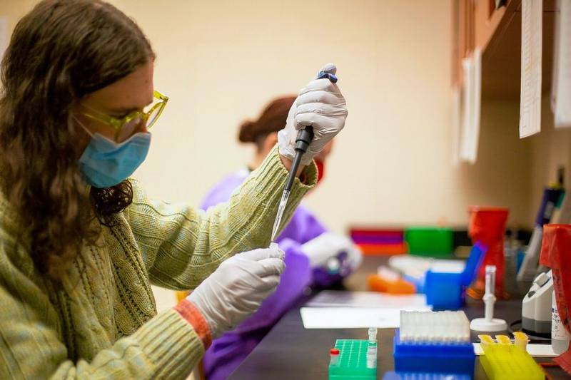 University of Illinois-Chicago student and doctoral candidate Christopher Owen prepares a sample of wastewater for COVID-19 analysis as part of a statewide infection surveillance program at the university.