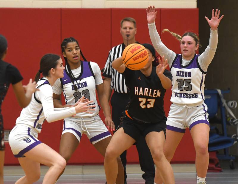 Dixon's Kiley Gaither (11), Ahmyrie McGowan (25), and Presley Lappin (25) defend against Harlem at the Oregon Girls Tip-Off Tournament on Wednesday, Nov. 19, 2025 in Oregon