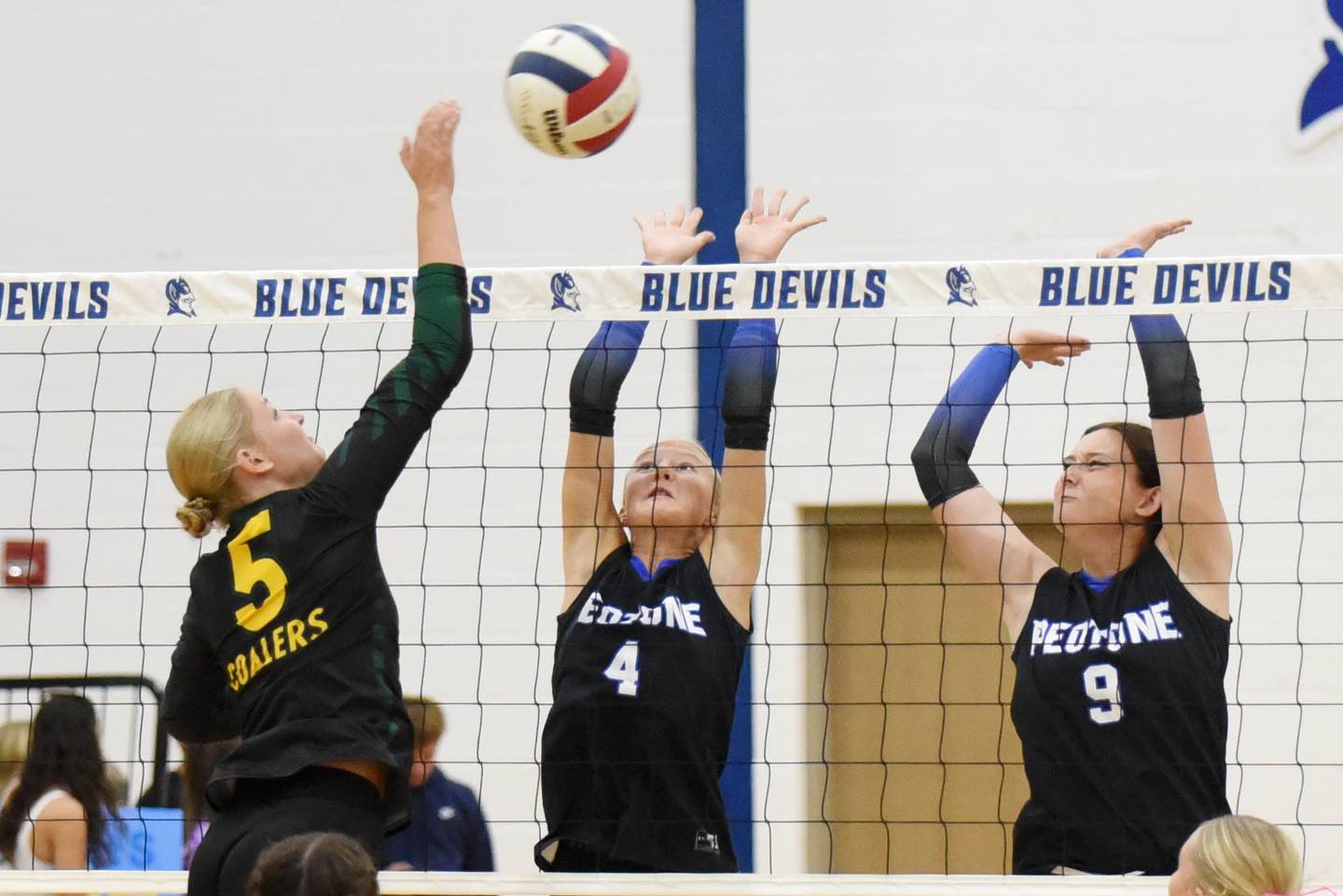 Peotone's Allie Werner (4) and Payton Schnelle (9) look to block a hit from Coal City's Averie Hodgen during a game at Peotone Thursday, Sept. 18, 2025.