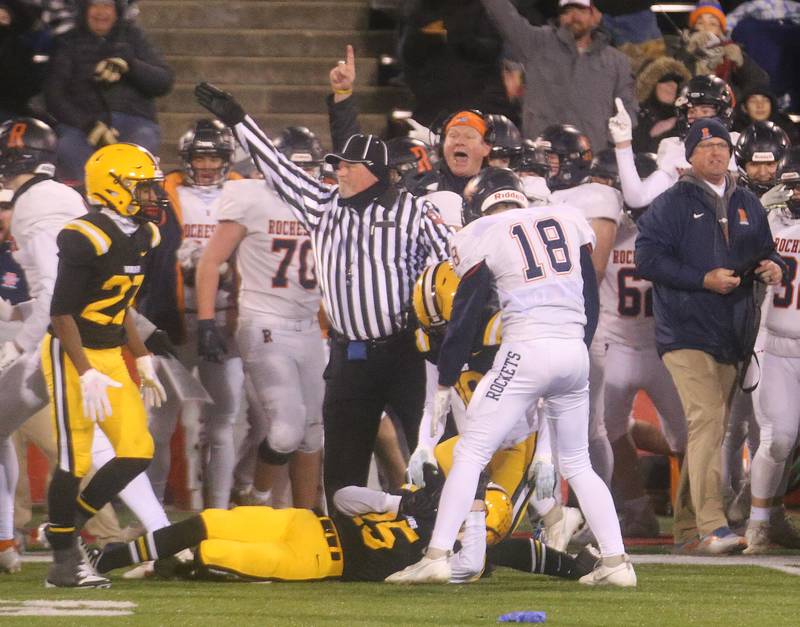 Rochester players react after getting a fumble recovery against St. Laurence during the Class 4A State football championship on Friday, Nov, 24, 2023 at Hancock Stadium in Normal.