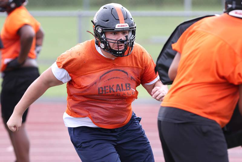 DeKalb's Anthony Fabricino takes part in an offensive line drill Monday, Aug. 8, 2022, at the school during their first practice ahead of the upcoming season.