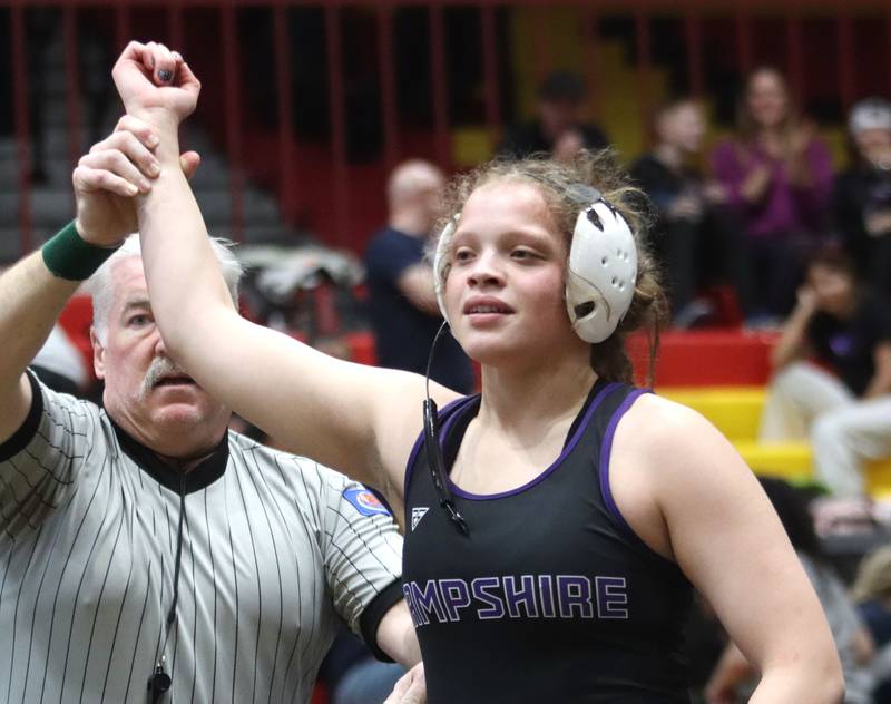 Hampshire’s Samantha Diehl is declared the winner against Schaumburg’s Nadia Razzak at 190 pounds in the title bout of varsity girls IHSA Sectional wrestling on Saturday, February 14, 2026, at Schaumburg High School in Schaumburg.