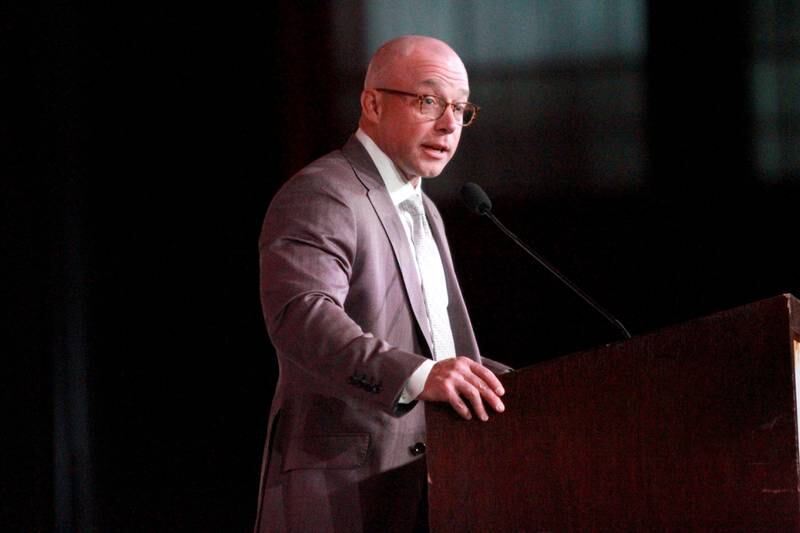 Joshua Feagans, chairman of the board of the St. Charles Chamber of Commerce, addresses the audience during the 56th Annual Charlemagne Awards Dinner at the Q Center in St. Charles on Friday, May 17, 2024.