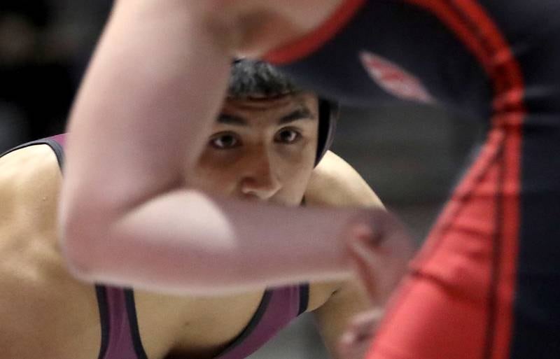 Prairie Ridge’s Aiden Rodriguez looks for an opportunity to take down Huntley’s Ajdin Ahmedi during the 175-pound match of a Fox Valley Conference boys wrestling meet on Thursday, Jan. 22, 2026, at Prairie Ridge High School Crystal Lake.
