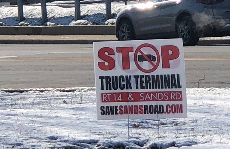 A "Stop Truck Terminal" sign is seen in Crystal Lake in December 2023.