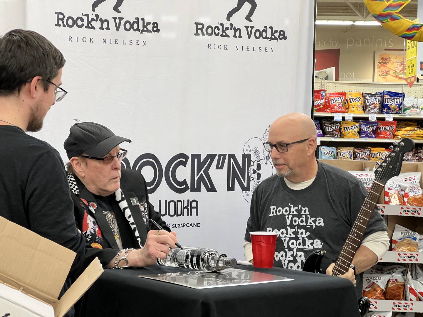 Rick Nielsen, founder of rock band Cheap Trick, signed bottles of Rock'n Vodka at Hy-Vee in Sycamore on Friday, Feb. 9, 2024.