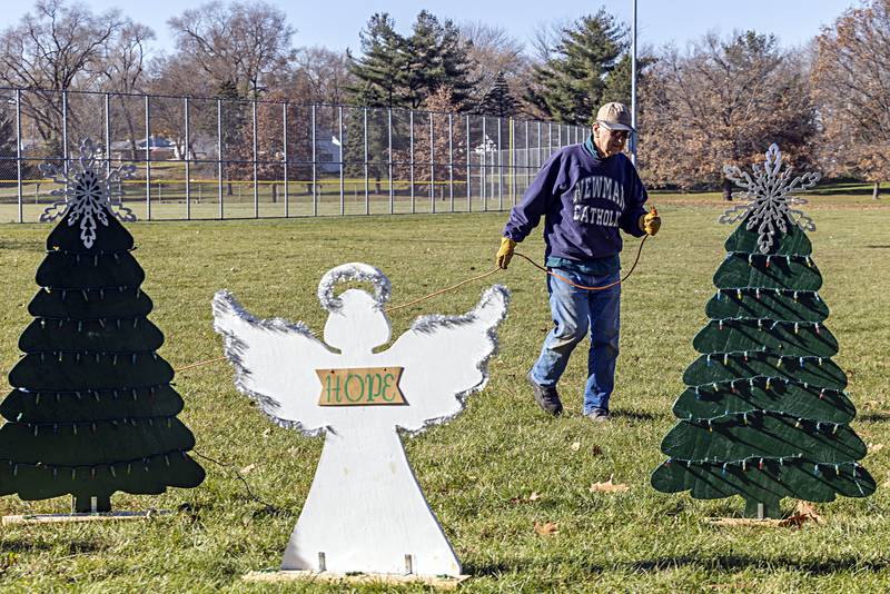 Mike Imel runs drop cords in the St. Andrew’s holiday light display Saturday, Nov. 18, 2023 at Centennial Park in Rock Falls. Saturday marked the day organizations could start to put together their displays ahead of next Friday’s opening.