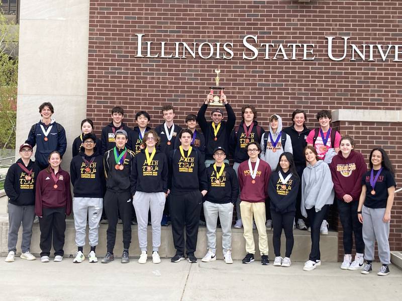 Montini: MathTeam_State - Math team celebrates 7th Place State finish on April 22nd at Illinois State University. Front row to to r:  Matthew Silveyra, Marin Ferris, Anjay Dhir, Conor Kaefer, Michael Crowley, Thomas Cyze, Alexander Silveyra, Joshua Brunke, Isabella Jaojoco, Cassidy McCarthy, Grace Landry, Savannah Gutierrez; Back Row:  Julian D’Anca, Seoyeon Park, Jack Barrett, Ray Li, Danny Sherman, Chrstopher Zayed; Joe Spaccapaniccia (holding trophy), Wyatt Prater, Charlie Paciga, Tommy Healy, Andy Sparke