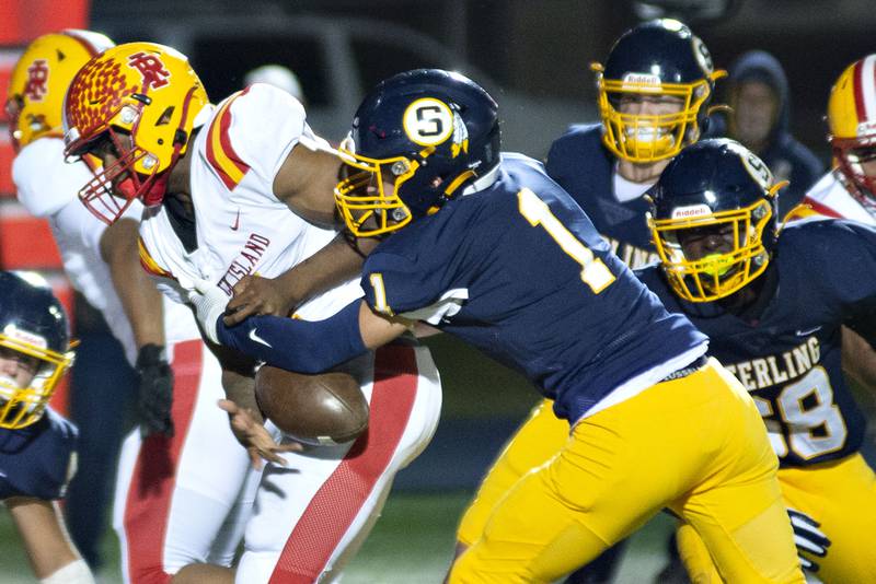 Sterling’s Tommy Tate strips the ball away from Rock Island runner Quonterrion Brooks Friday, Oct.7, 2022.