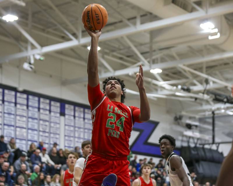 LaSalle Peru's Marion Persich (24) puts in a lay up during their Plano Christmas Classic semi-final basketball game between Kaneland at LaSalle Peru Monday, Dec 29, 2025 in Plano.