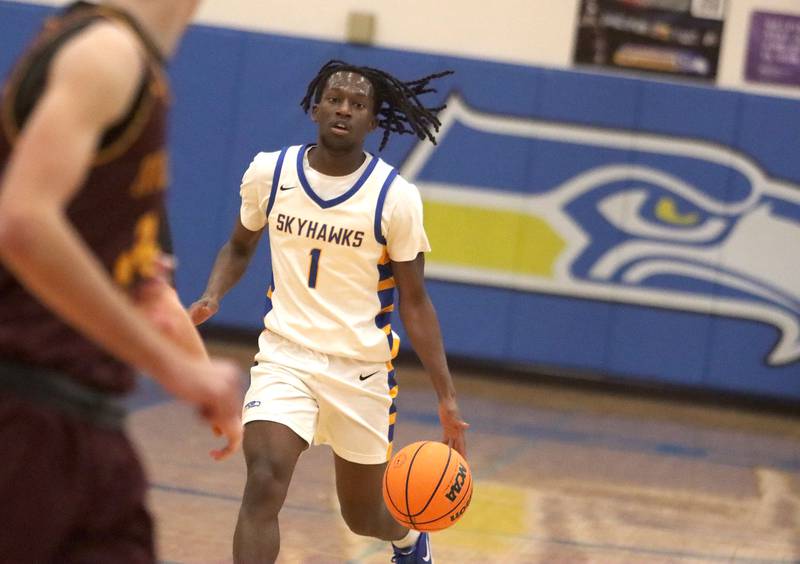 Johnsburg’s Jarrel Albea moves the ball against Richmond-Burton in varsity boys basketball onTuesday, Dec. 9, 2025, at Johnsburg High School in Johnsburg.