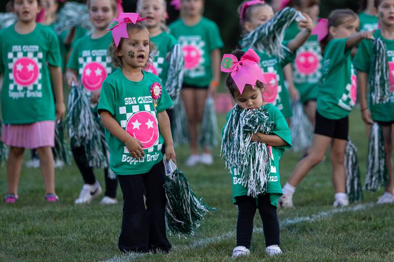 Boppin' Bruins cheerleader prepare for performance on Friday, Sept 12, 2025 at Captain Thomas J. Heitmann field in Peru.